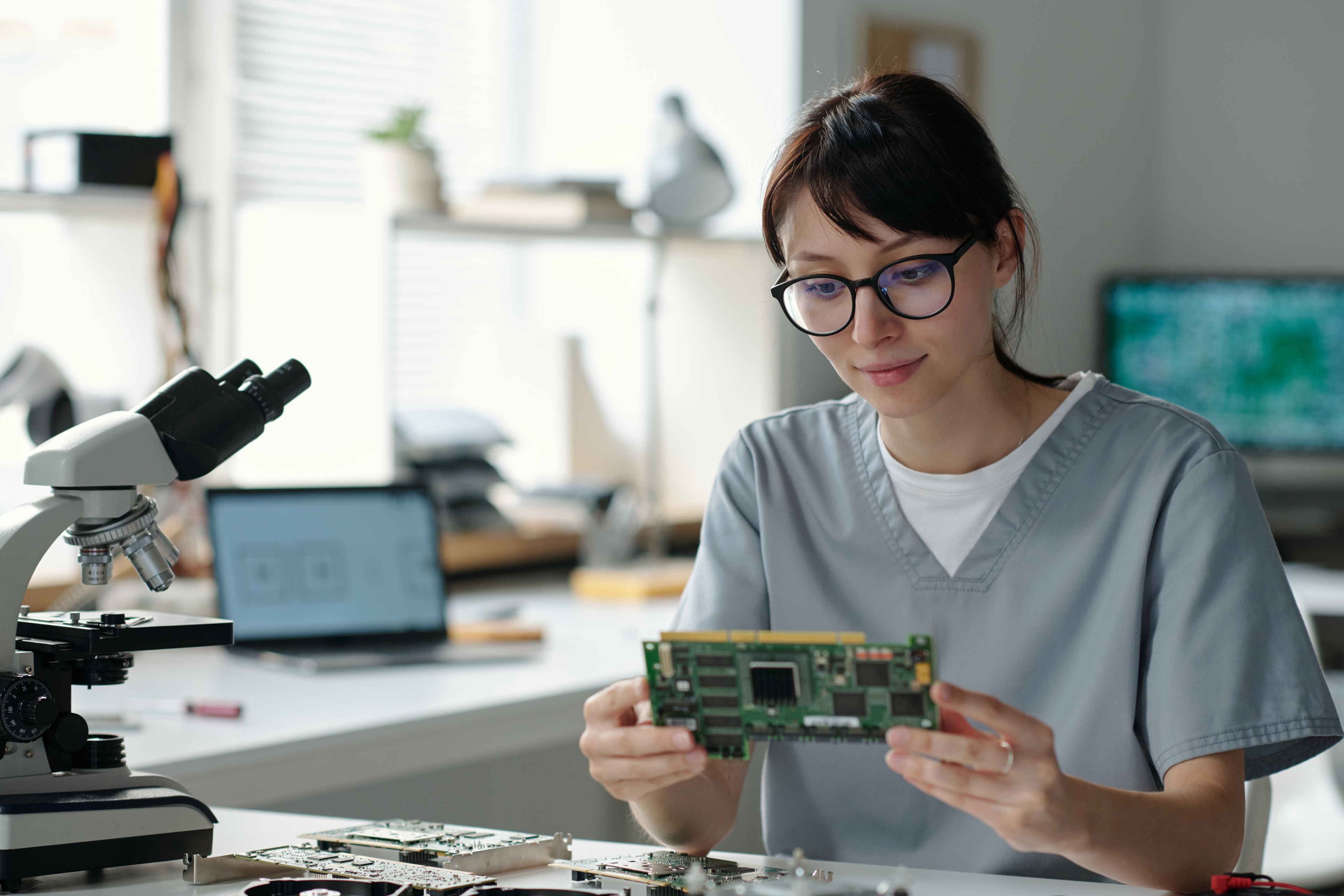 Technician checking computer motherboard content-image